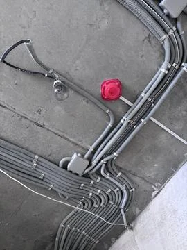 Installation of electrical wiring on the ceiling. 스톡 사진