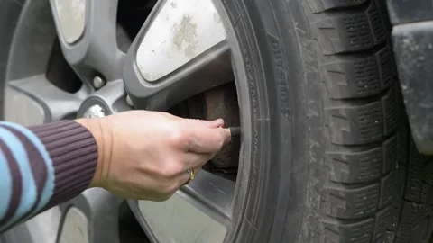 Installation of an electronic tire pressure sensor Stock Footage 218814410