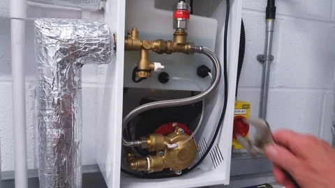 Installation engineer checking plumbing connections Stock Footage 96463670