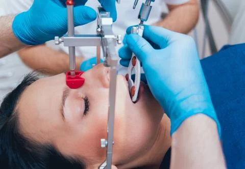 Installation of the face-bow. Functional diagnostics. Dental technology 写真素材