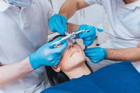 Installation of the face-bow. Functional diagnostics. Dental technology Stock Photos