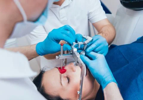 Installation of the face-bow. Functional diagnostics. Dental technology 写真素材