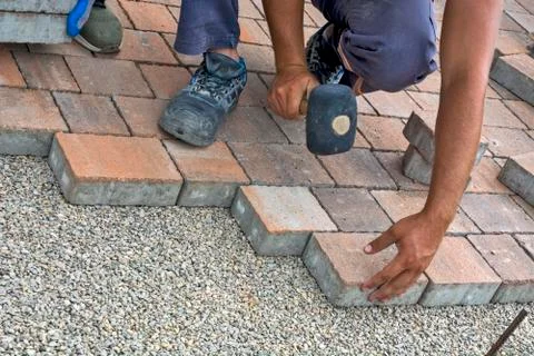 Installation of floor bricks Stock Photos