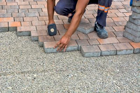 Installation of floor bricks Stock Photos