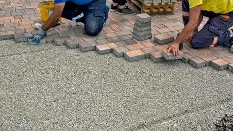 Installation of floor bricks Stock Photos