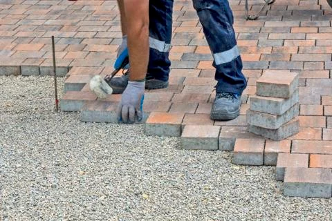 Installation of floor bricks Stock Photos