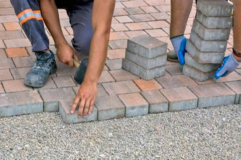 Installation of floor bricks Stock Photos