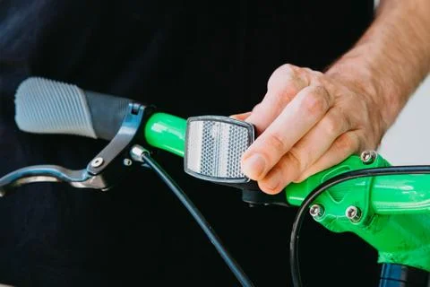 Installation of a front reflective green fix bike with white tires Stock Photos