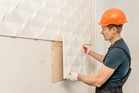 Installation of gypsum 3D panel. Stock Photos