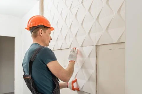 Installation of gypsum 3D panel. Stock Photos