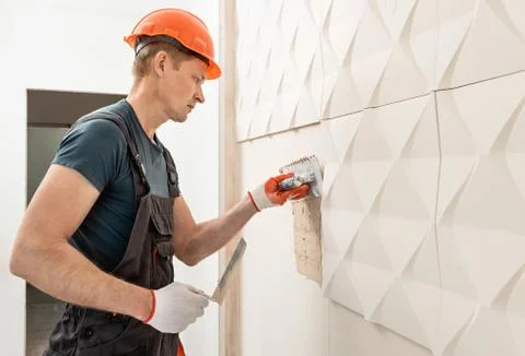 Installation of gypsum 3D panel. Stock Photos