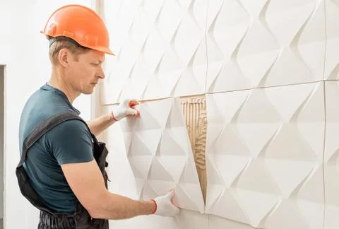 Installation of gypsum 3D panel. Stock Photos