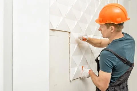 Installation of gypsum 3D panel. Stock Photos