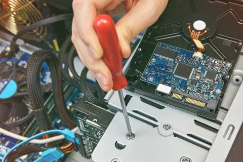 Installation of hard disk drive of personal computer. Stock Photos