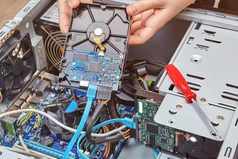 Installation of hard drive in personal computer. Stock Photos