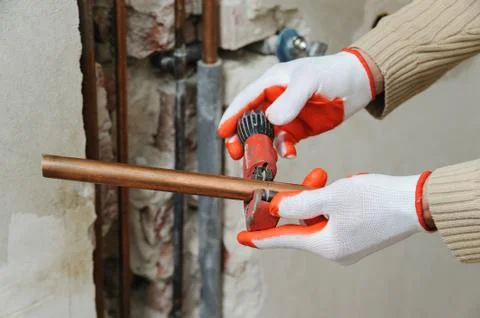 Installation of heating from copper pipes. Stock Photos