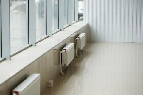 The installation of the heating system in a large room Stock Photos