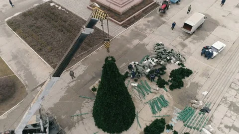 Installation of a holiday tree On the Square Of The City Stock-Footage 100088534