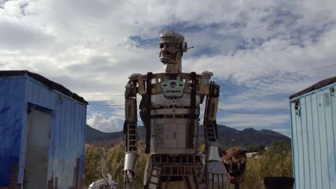 Installation Of Huge Iron Robot On Sky And Mountain Background Stock Footage 83284965