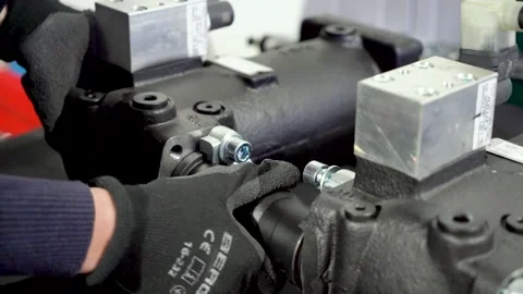 Installation of hydraulic and electrical equipment. Connection of pressure se Stock Footage 227937657