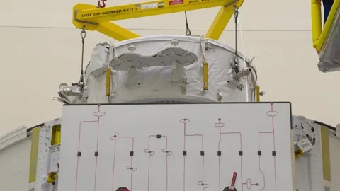 Installation of the IDA-3 into the trunk of SpaceX's Dragon spacecraft Stock Footage 289728846