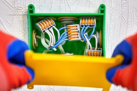 Installation of junction box for concealed wiring. Fotos de archivo