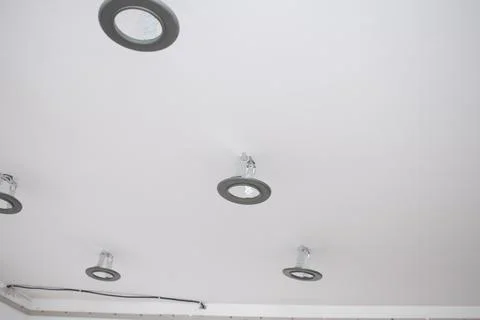 Installation of LED lamps on a stretch ceiling Stock Photos