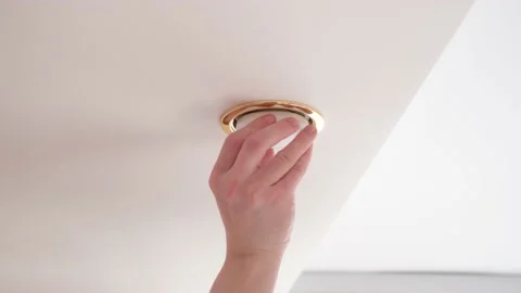 Installation of a LED light bulb on the ceiling. Stock Footage 152612649