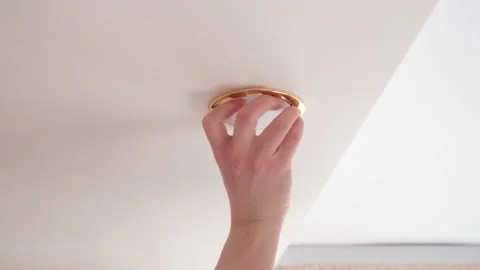 Installation of a LED light bulb on the ceiling. Stock Footage 152612716