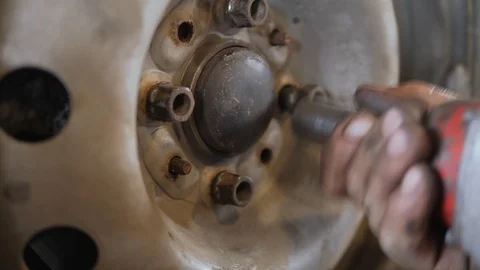 Installation of the machine wheel. Stock Footage 105417328