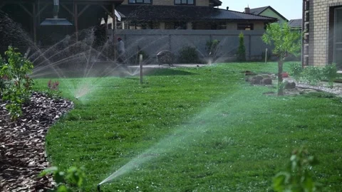 Installation modern garden irrigation system watering lawn.Modern device of i Stock Footage 208353136