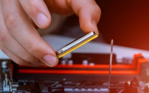 Installation of modern processor in CPU socket on the motherboard 스톡 사진