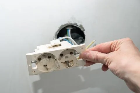 Installation of new electrical wiring, plastic socket and electric wires for  Stock Photos