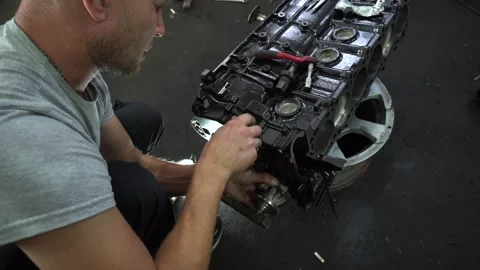 Installation of new engine cover and paw seals Stock Footage 325767908