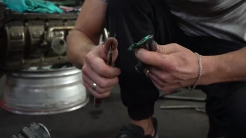 Installation of new engine cover and paw seals Stock Footage 325767936