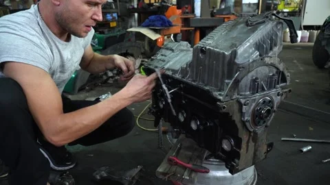 Installation of new engine cover and paw seals Stock Footage 325768085