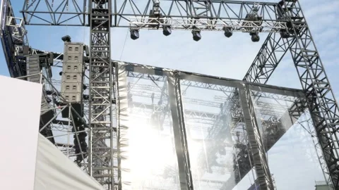 Installation or construction of a huge large stage for an outdoor concert. Metal Stock Footage 301778966