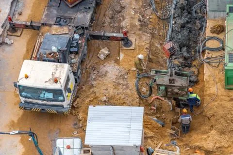 Installation of piles at a building site using an outboard power plant for dr Fotos Stock