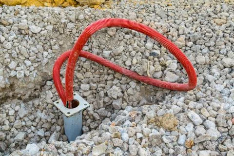Installation of power cable in flexible PVC pipe Stock Photos