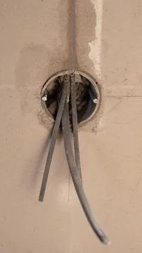 Installation Of Power Cables In New Construction Site. Industrial Style Stock Photos