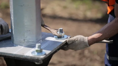 Installation of power lines. Workers tighten the nuts  Stock Footage 106489288