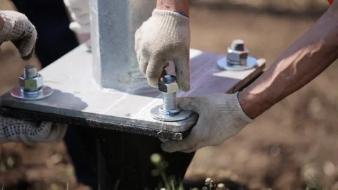 Installation of power lines. Workers tighten the nuts  Stock Footage 106489391