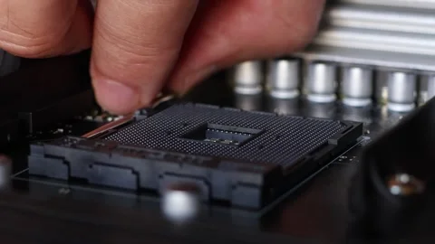 Installation process of CPU AMD Ryzen processor in AM4 socket on motherboard. Stock Footage 312160039