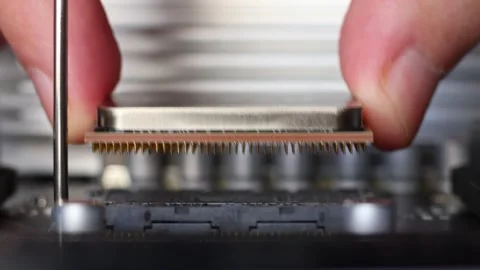 Installation process of CPU AMD Ryzen processor in AM4 socket on motherboard. Stock Footage 312160148