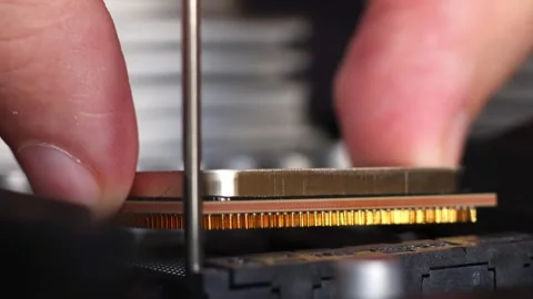 Installation process of CPU AMD Ryzen processor in AM4 socket on motherboard. Stock Footage 312160227