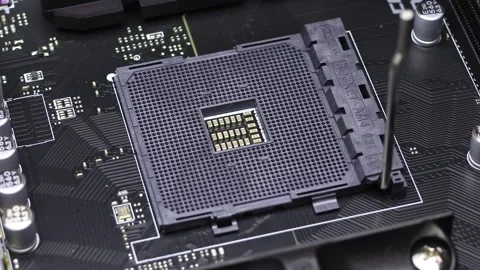 Installation process of CPU AMD Ryzen processor in AM4 socket on motherboard. Stock Footage 312160312