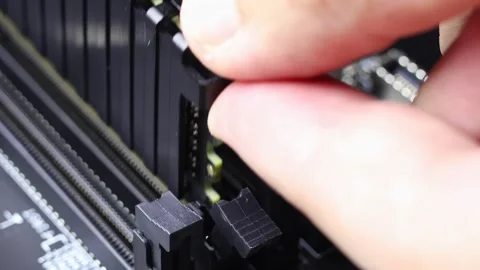 Installation process of DDR4 Memory modules in RAM slots on B550 motherboard. Stock Footage 312160244