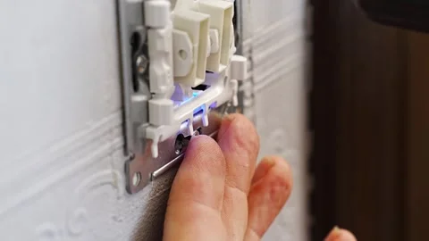 Installation process of electric switch in residential setting Stock Footage 307609334