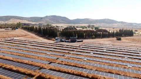 Installation process of solar panel banks with machinery Stock Photos