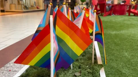 An installation of Progress Pride Flags in a mall Stockbeeldmateriaal 243702828
